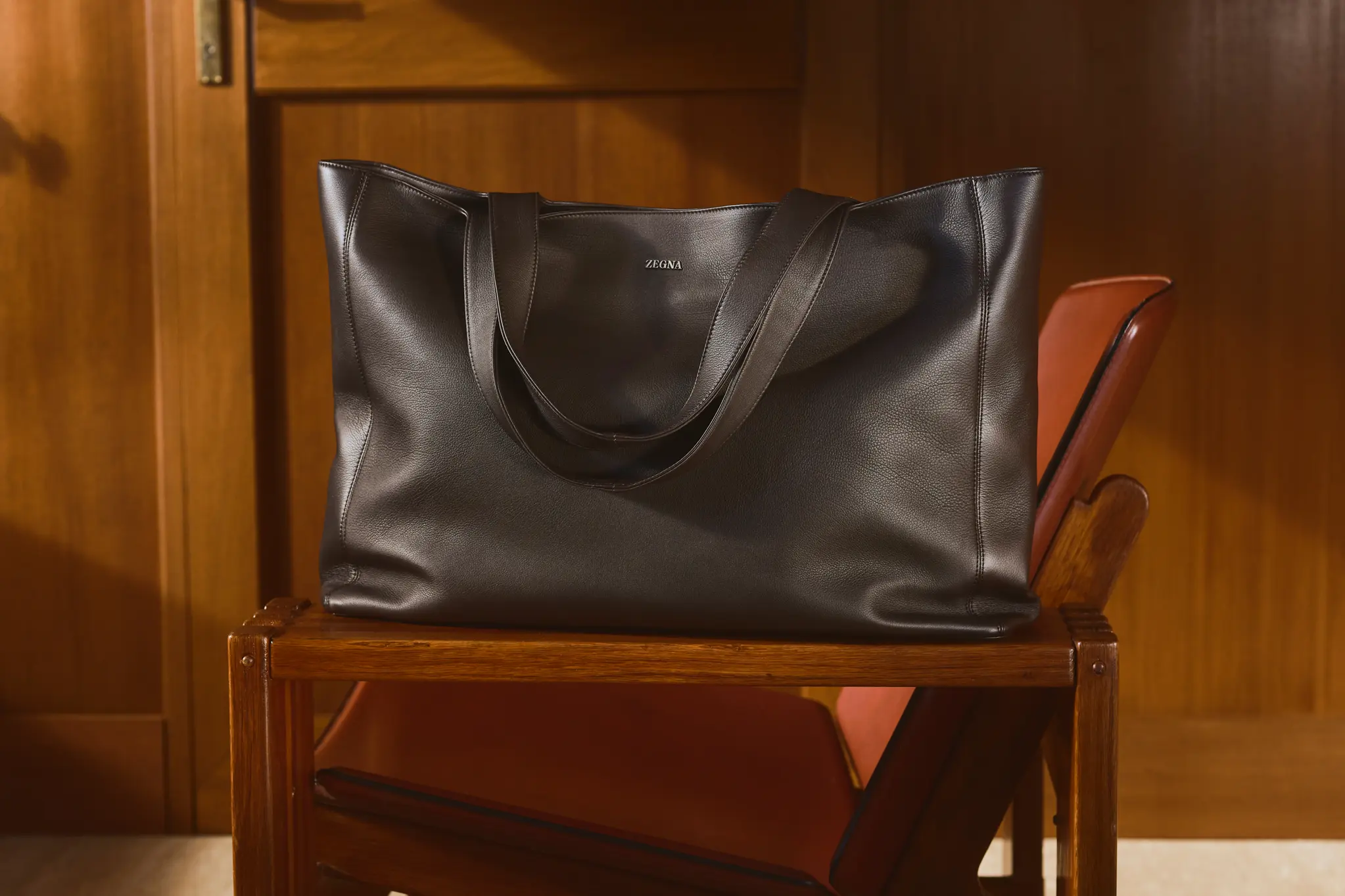 Detail of the Soft Tote bag in dark brown leather with double top handles, from the ZEGNA Fall/Winter 2026 collection.