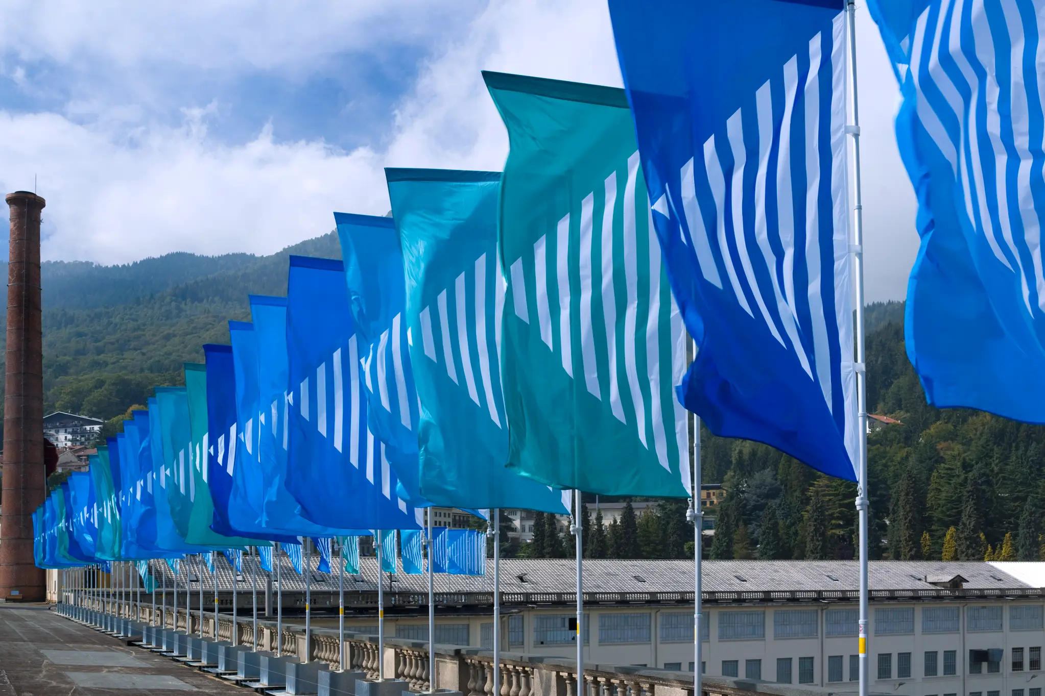 Lanificio ZEGNA and Art Basel installation with blue and green flags.