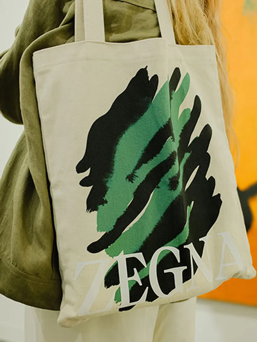 ZEGNA Art Basel tote bag carried by a visitor at the event.