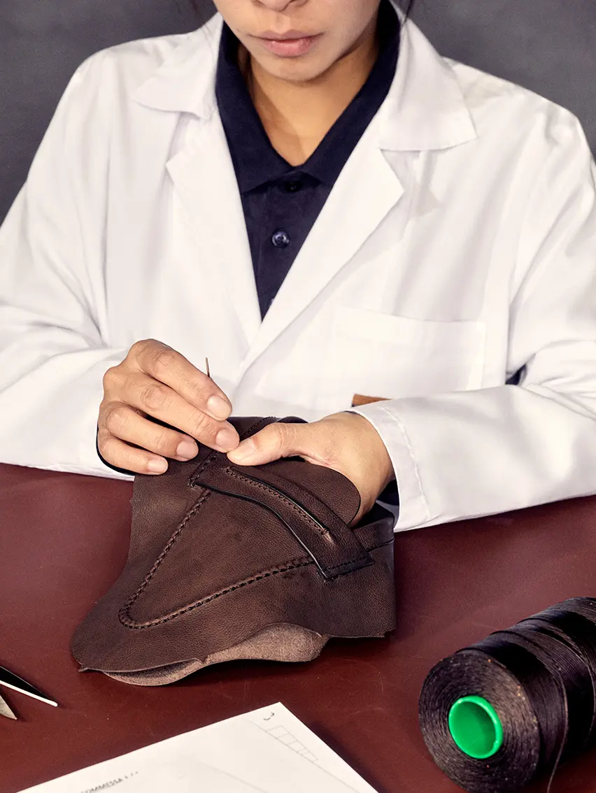 Skilled artisan assembling the components of ZEGNA's Mocassin.