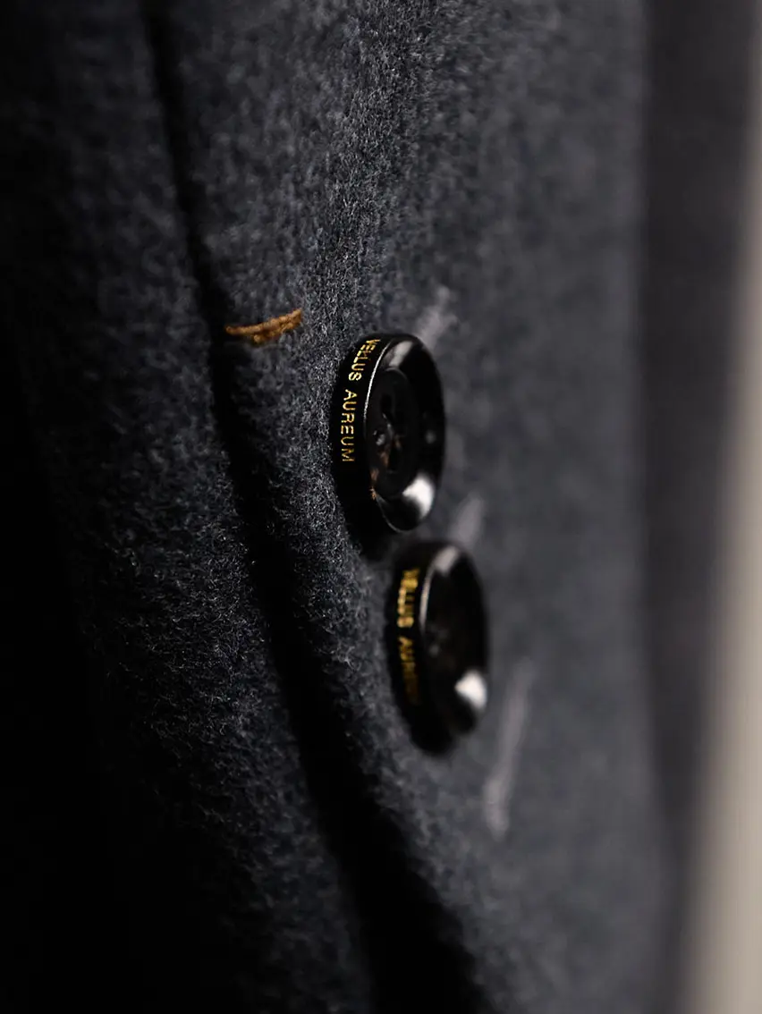 Close-up of artisanal buttons on ZEGNA’s Torino Style jacket, showcasing Italian craftsmanship and timeless design.