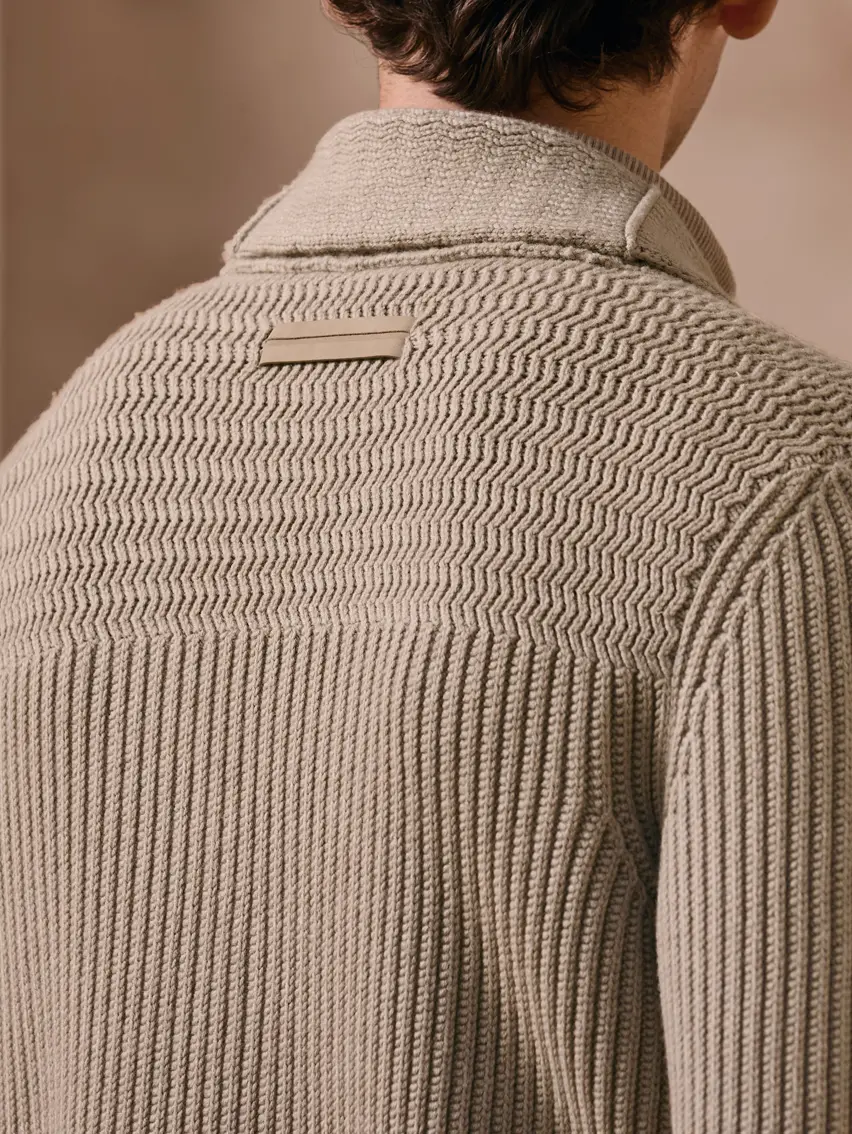 Tailored menswear look with layered knitwear from the ZEGNA FW25 collection.