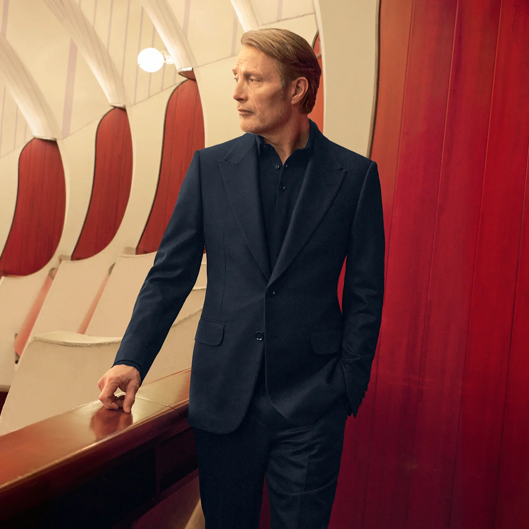 Mads Mikkelsen in an elegant navy suit embodying Italian elegance, from the ZEGNA FW25 collection.