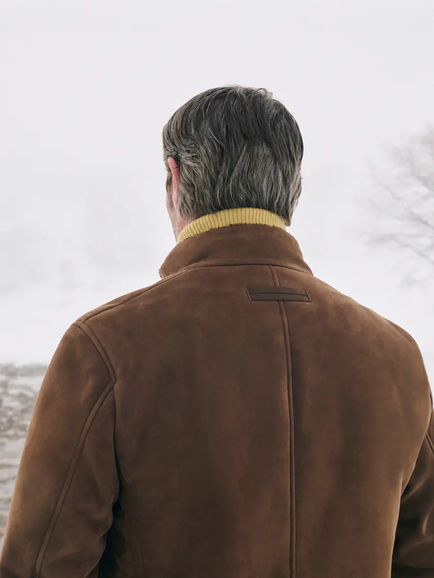 Mads Mikkelsen wearing a ZEGNA winter look featuring a Conte jacket.