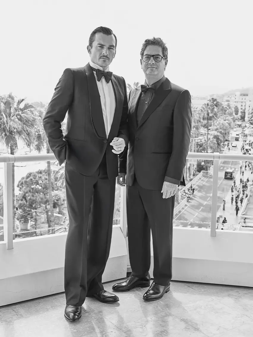 Two men wearing elegant ZEGNA tailored suits.