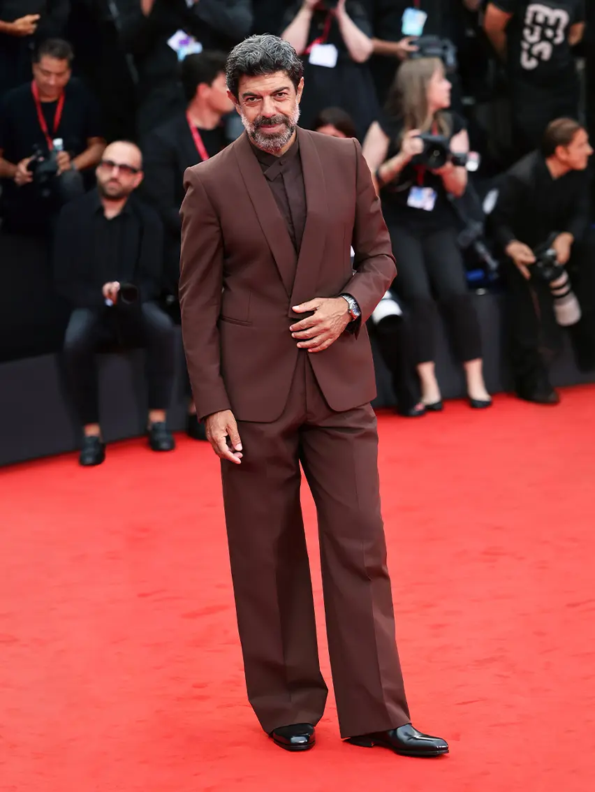 Pierfrancesco Favino wearing a ZEGNA suit on the red carpet at the Venice Film Festival 2025.