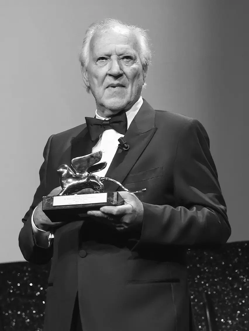 Werner Herzog wearing a ZEGNA tuxedo on the red carpet at the Venice Film Festival 2025.