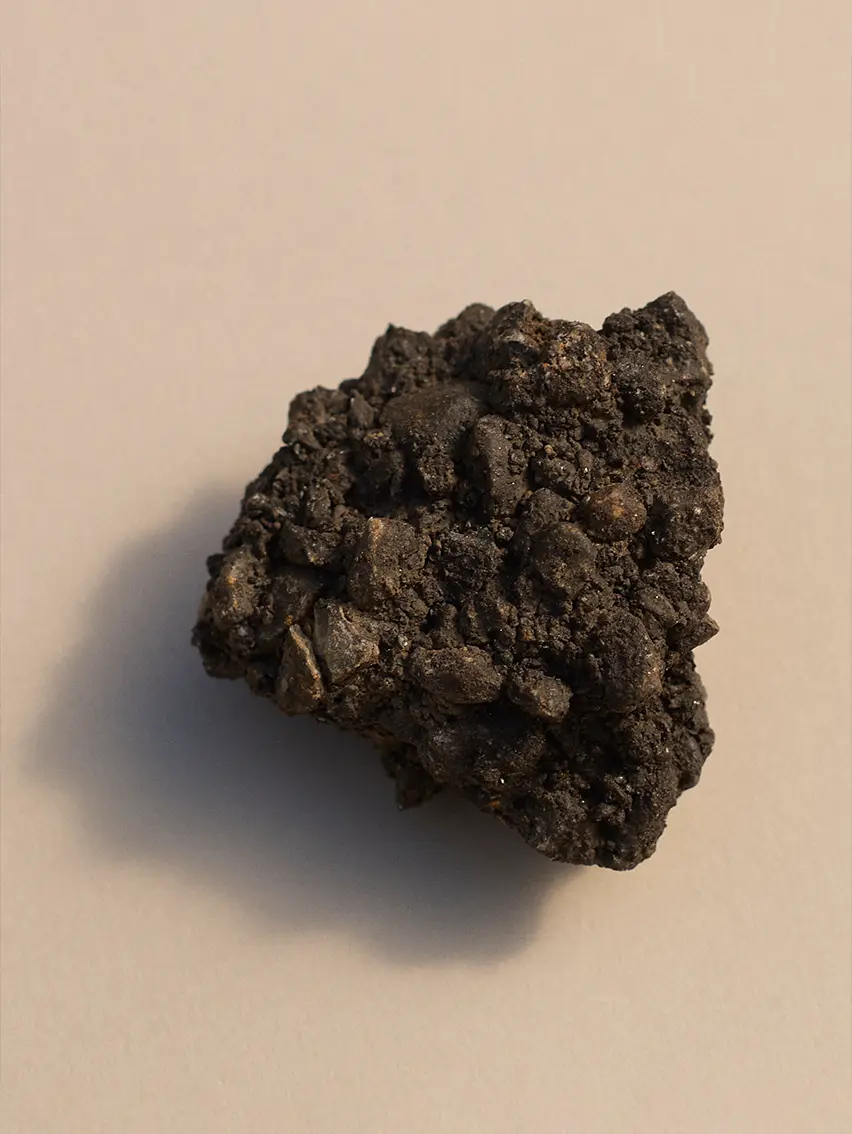Textured mineral rock fragment inspired by the natural landscape of Oasi Zegna.