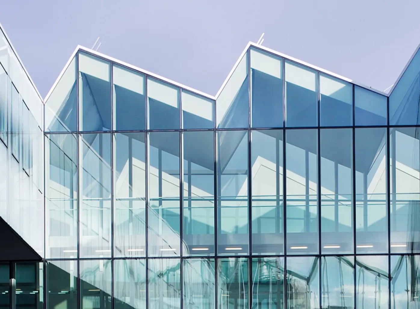 ZEGNA HQ Milan modern glass architecture exterior view showcasing headquarters building design.