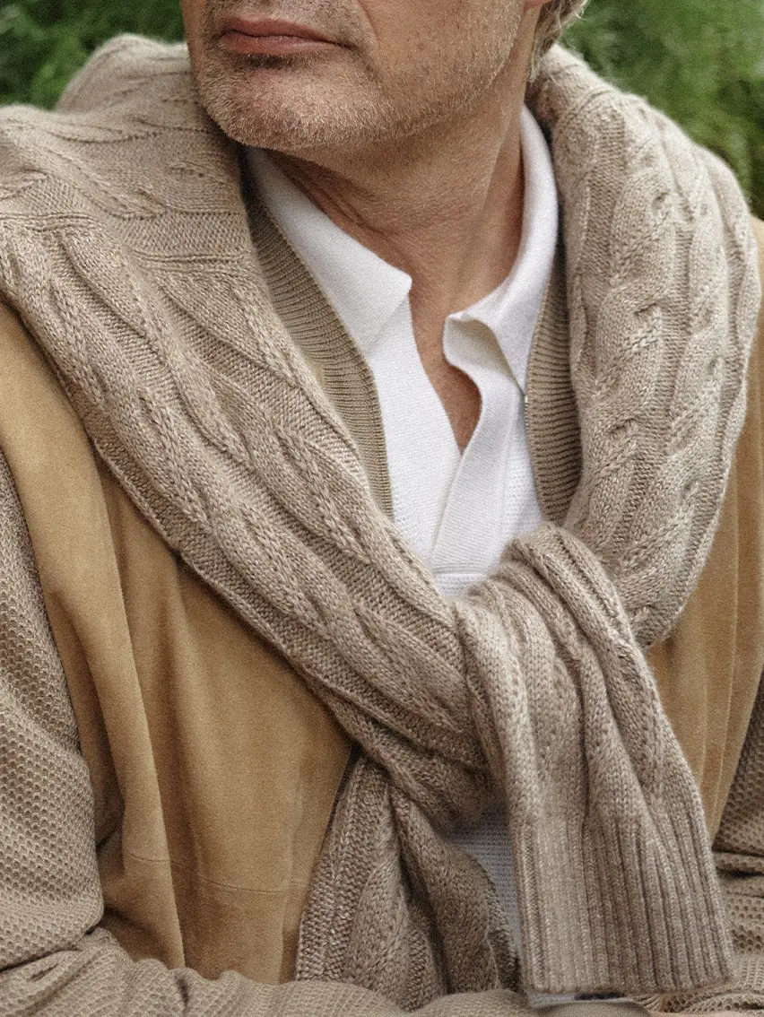 Mads Mikkelsen wearing a cashmere bomber, lightweight knitwear crew neck and sunglasses from the ZEGNA SS26 collection.