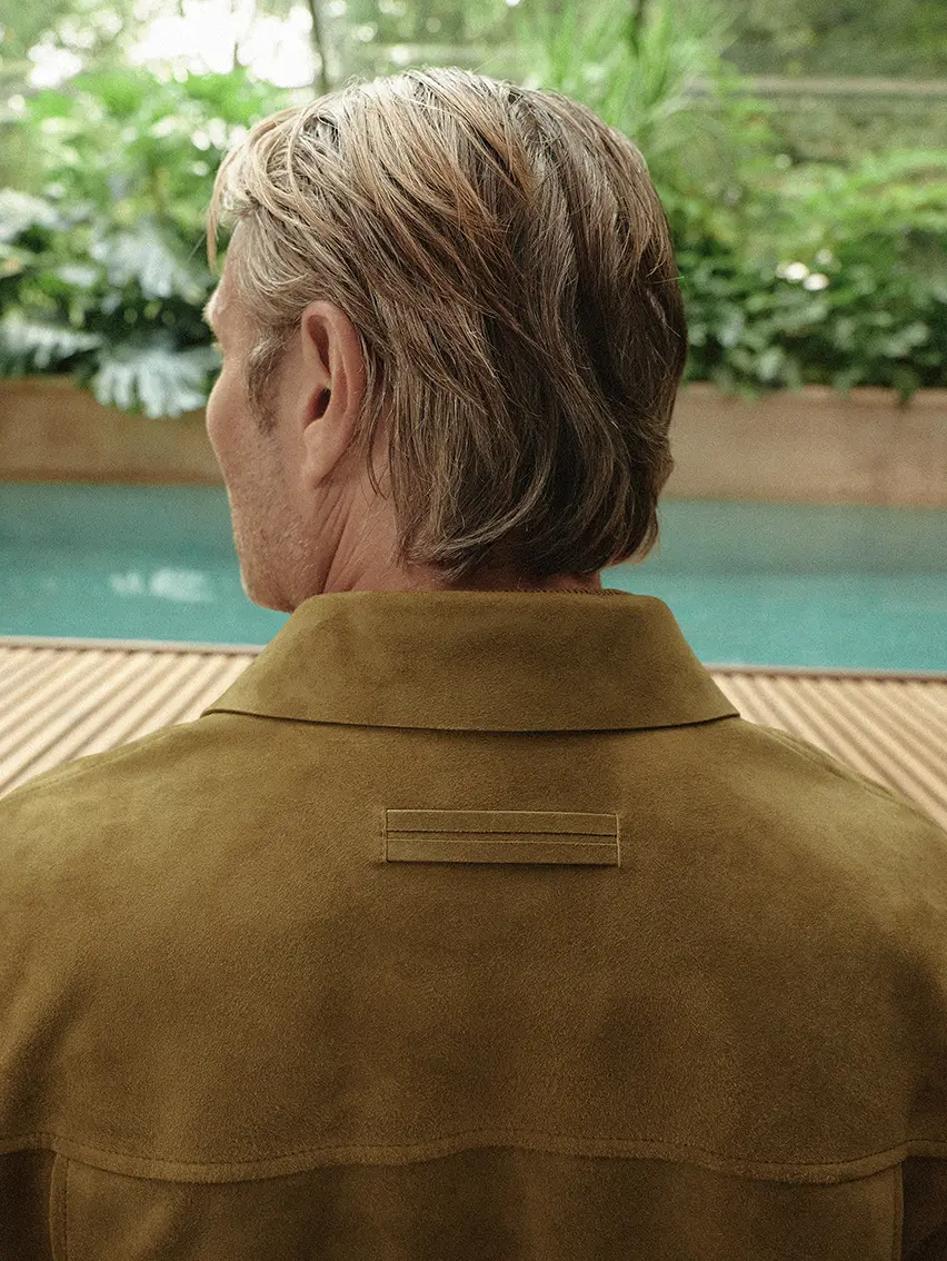 Close-up of Mads Mikkelsen wearing a SECONDSKIN leather jacket from ZEGNA fashion show ss26.
