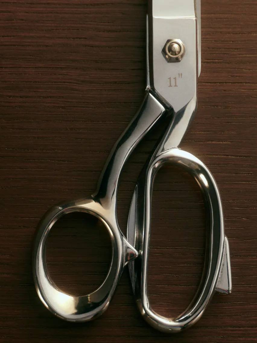 Close up of tailoring scissors.