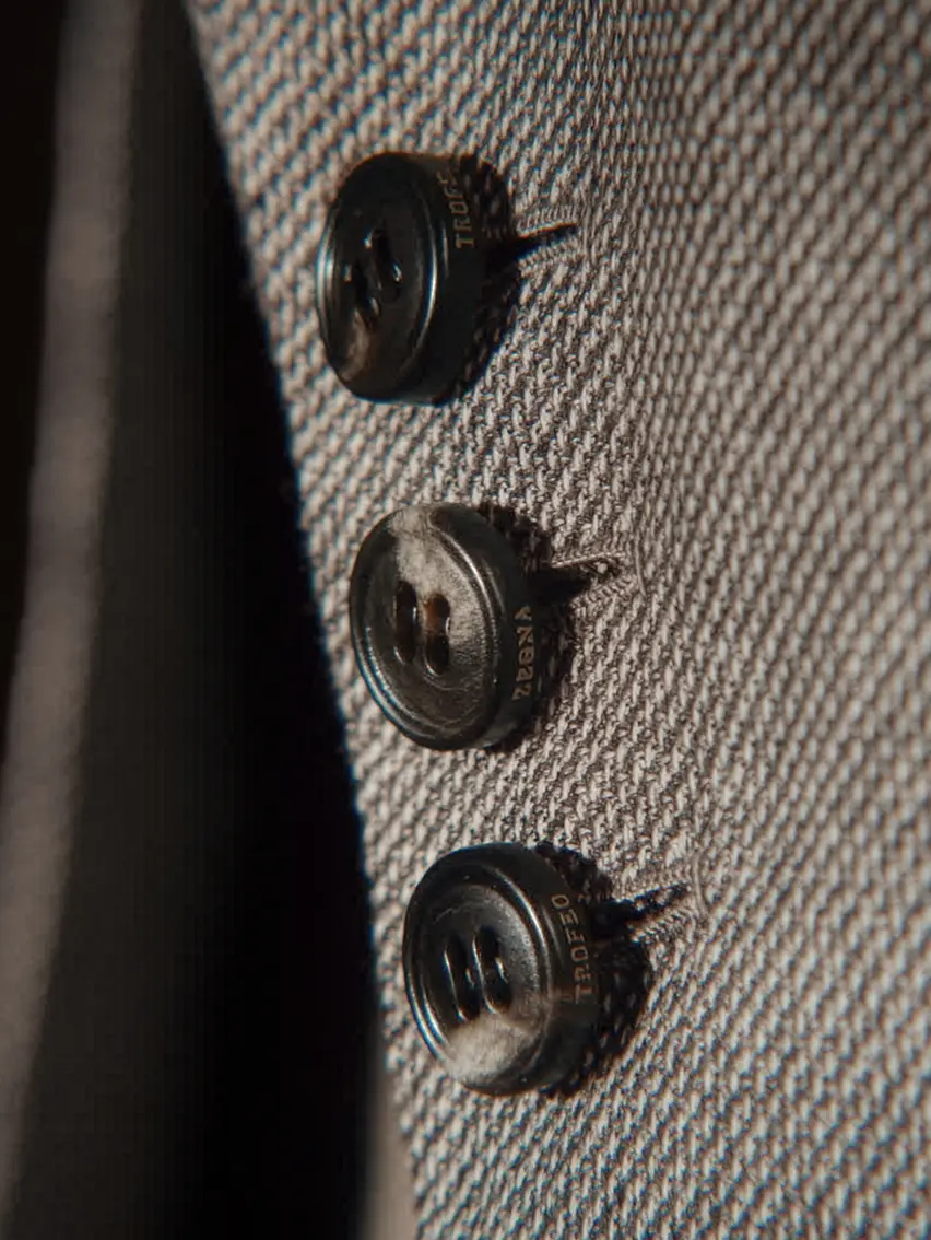 Close up of ZEGNA jacket buttons.