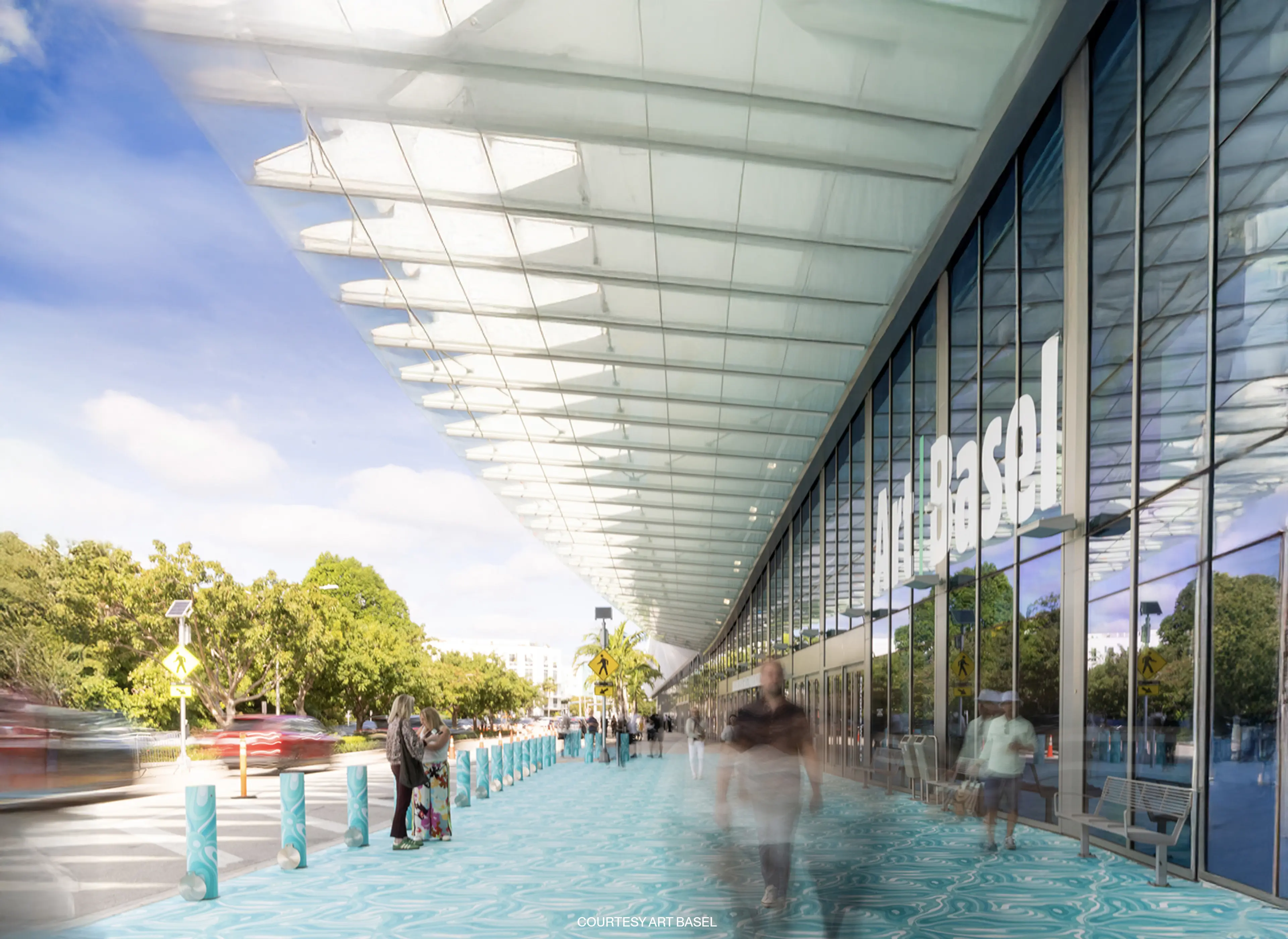 Exterior view of the Miami Beach Convention Center surrounded by palm trees.