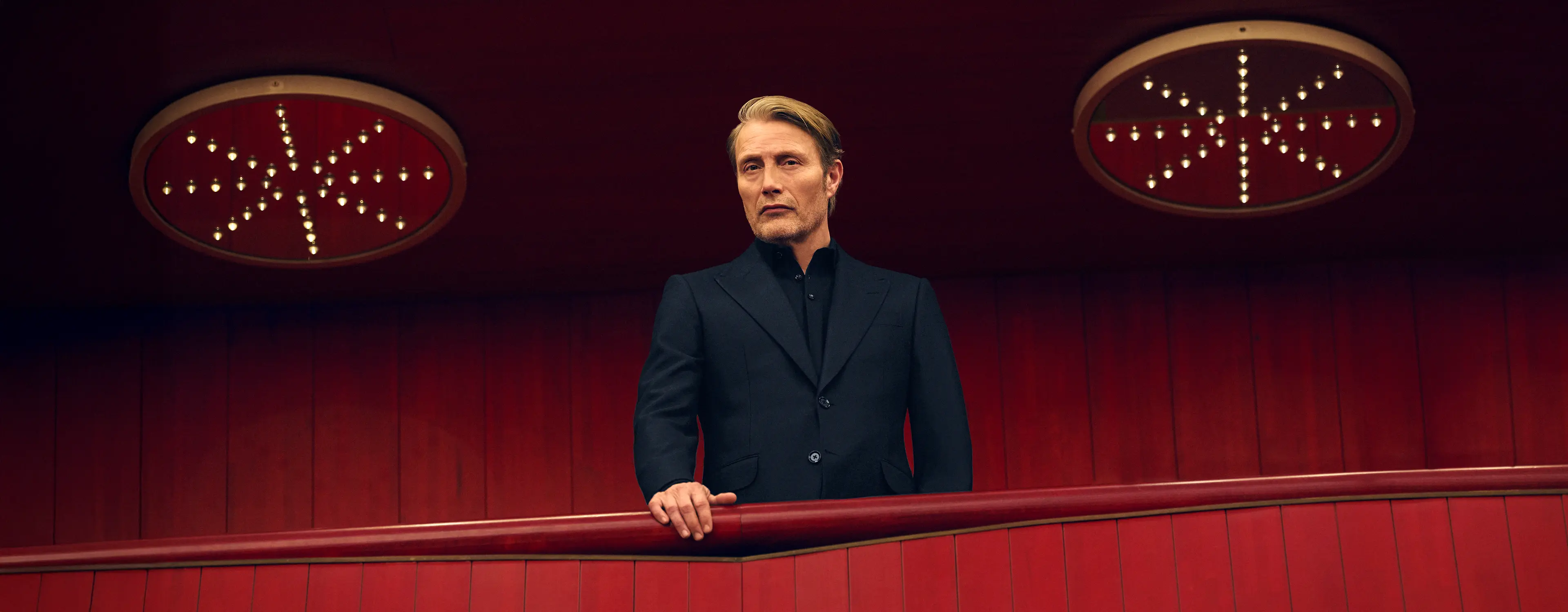 Mads Mikkelsen wearing a dark navy Torino style suit at Teatro Regio, from the ZEGNA Fall/Winter 2025 collection.
