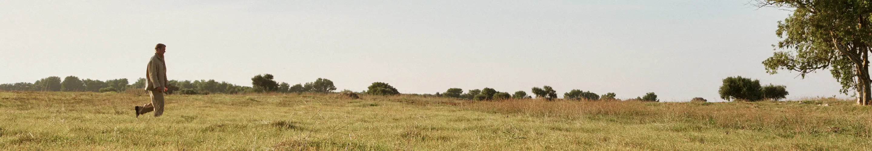 Mads Mikkelsen wearing a tailored outfit with a coat from the ZEGNA Spring/Summer 2025 collection.