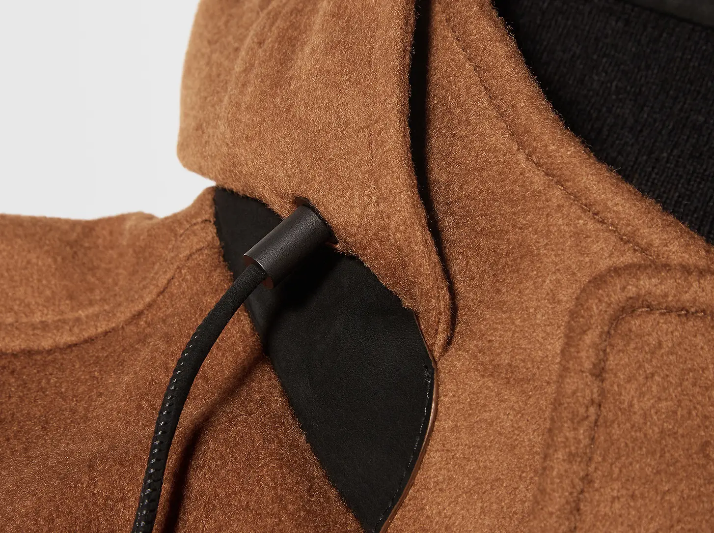 The hood features leather details.
