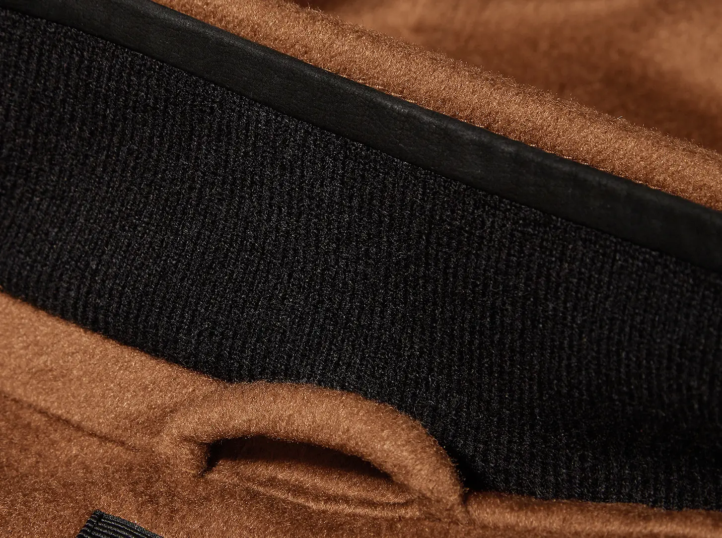 The collar features a knit lining.